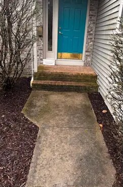 Front walkway pressure washing in Kalamazoo, MI, before cleaning